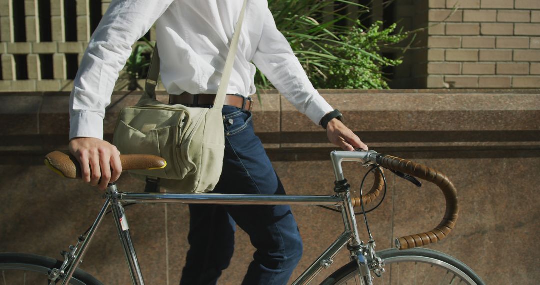 Commuter Walking Bicycle in Urban Setting - Free Images, Stock Photos and Pictures on Pikwizard.com