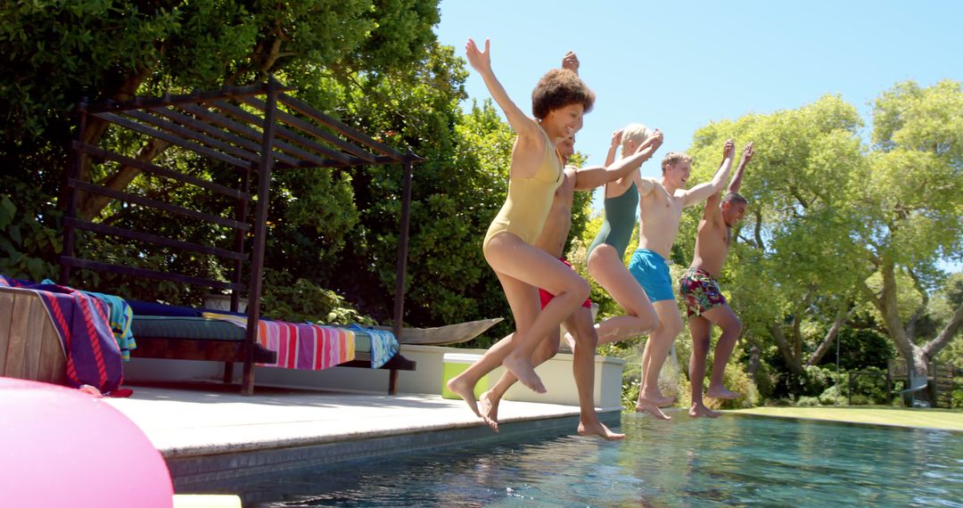 Group of Friends Jumping into Pool on Sunny Day - Free Images, Stock Photos and Pictures on Pikwizard.com