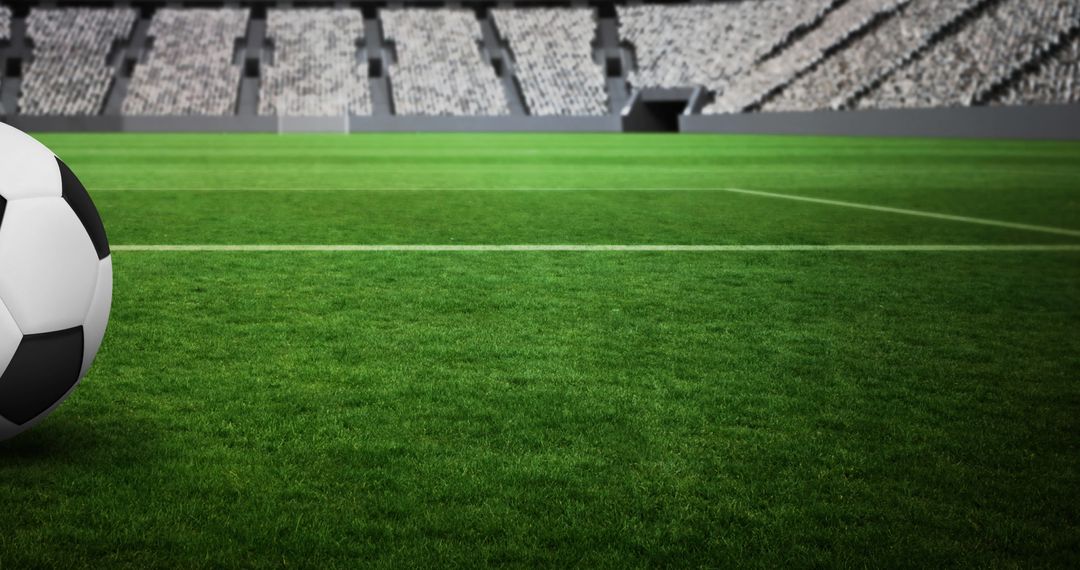 Soccer Ball on Green Field in Empty Stadium
