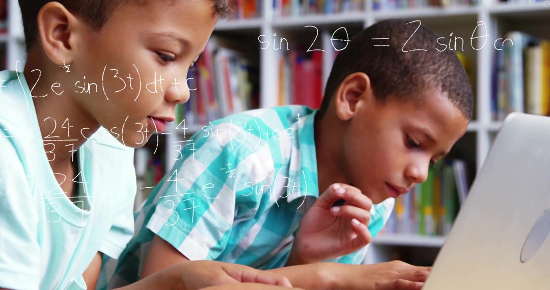 Two Boys Solving Math Problems with Laptop in Study Room
