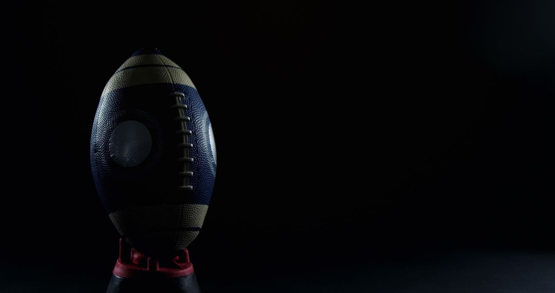 American Football in Low Light with Dark Background - Free Images, Stock Photos and Pictures on Pikwizard.com