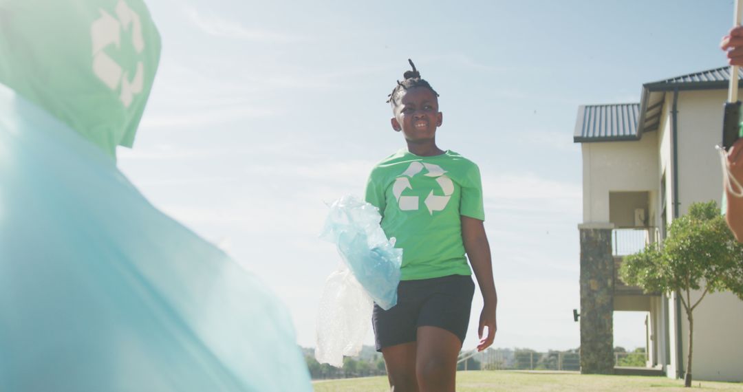 Young African American Girl Participating in Community Recycling Initiative - Free Images, Stock Photos and Pictures on Pikwizard.com