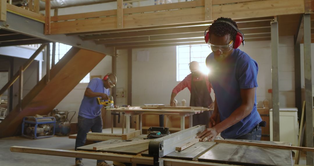 Skilled Woodworkers Collaborating in Well-equipped Workshop