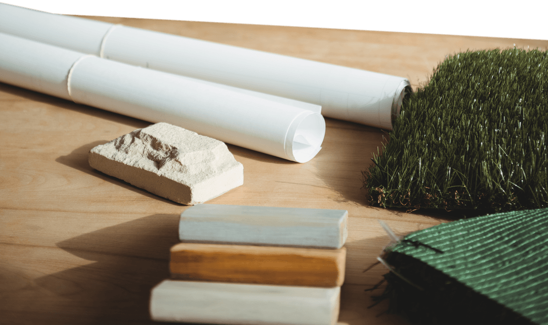 Transparent Architectural Plans with Landscape Elements on Table