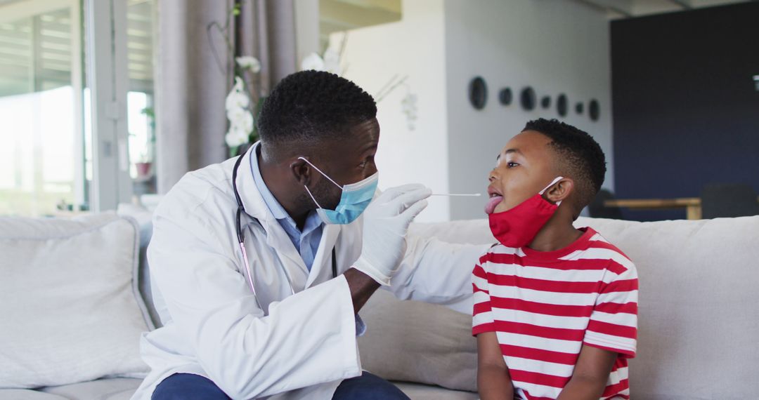 African American Doctor Performing Throat Swab on Child in Home - Free Images, Stock Photos and Pictures on Pikwizard.com