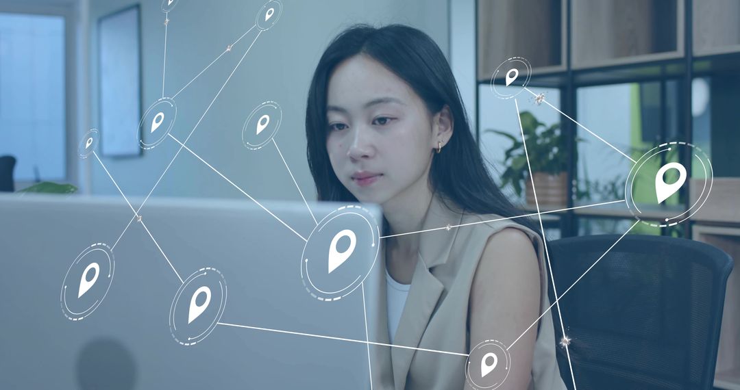 Woman in Blazer Working on Laptop with Holographic Map Network