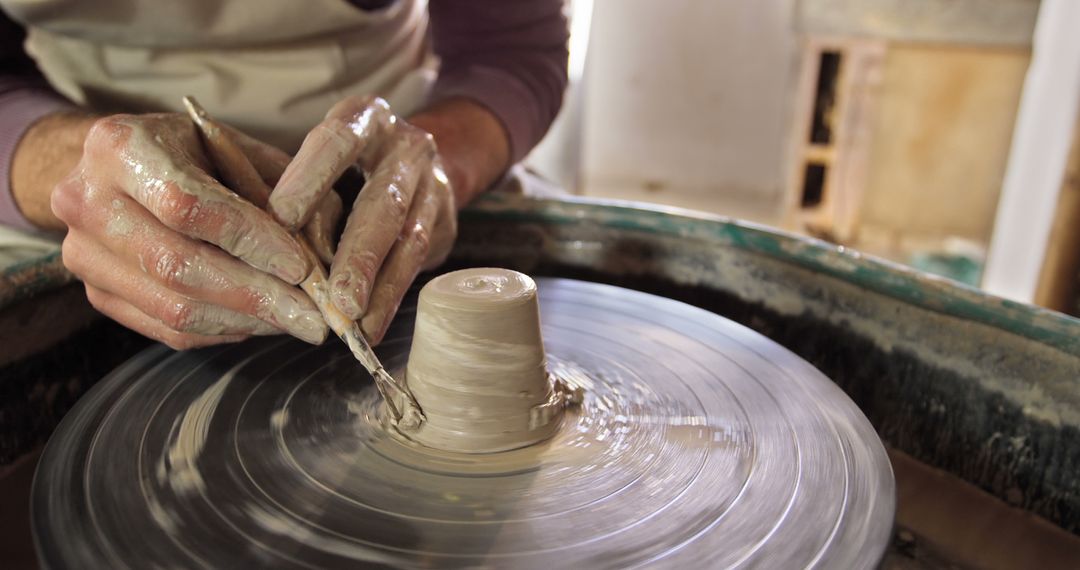 Hands Shaping Clay on Pottery Wheel in Ceramics Studio - Free Images, Stock Photos and Pictures on Pikwizard.com