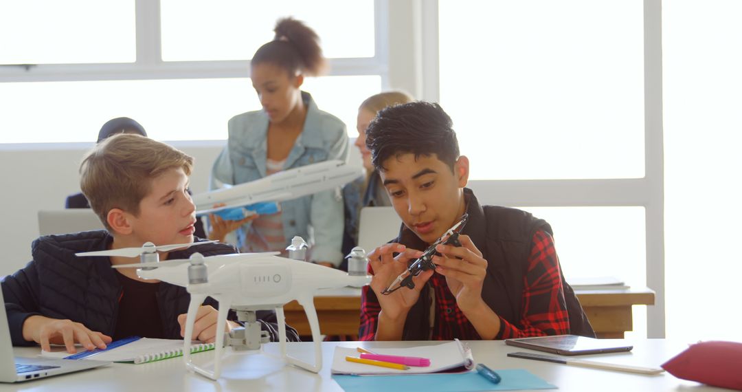 Diverse Students Collaborating on Drone Project in Classroom - Free Images, Stock Photos and Pictures on Pikwizard.com