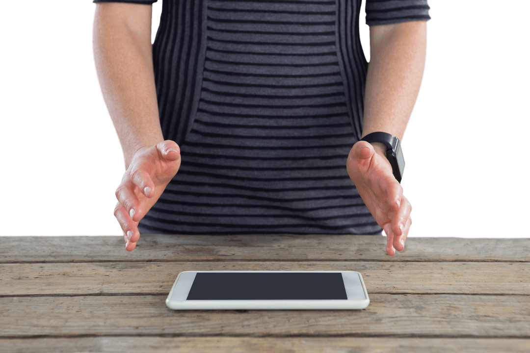 Transparent midsection person gestures above tablet on wooden table