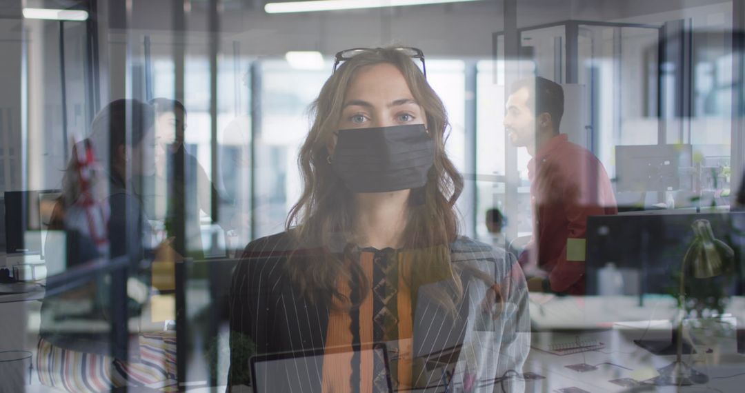Businesswoman in Mask in Office with Colleagues during Pandemic