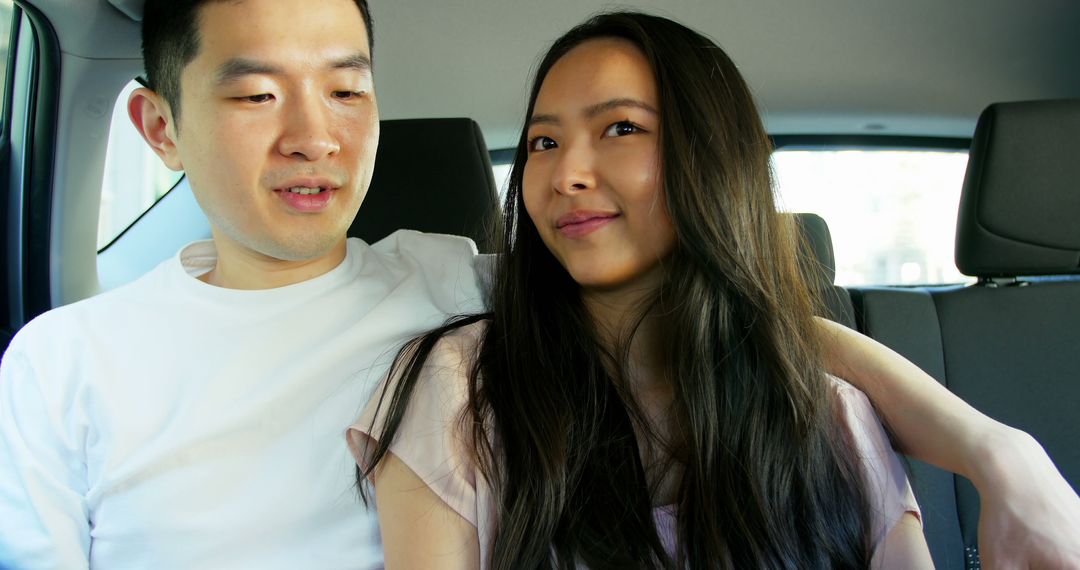 Young Couple Relaxing in Car Creating Plenty of Copy Space