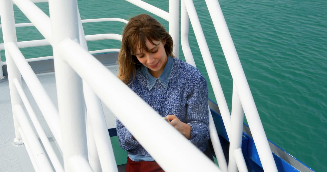 Woman Enjoying View on Boat Deck - Free Images, Stock Photos and Pictures on Pikwizard.com