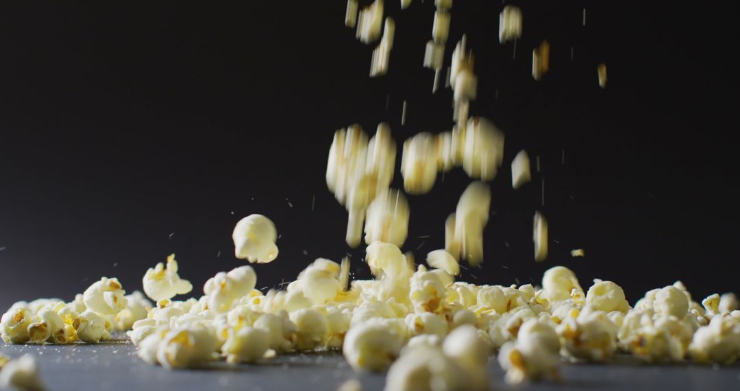 Falling Popcorn on Black Background - High-Speed Close-Up - Free Images, Stock Photos and Pictures on Pikwizard.com