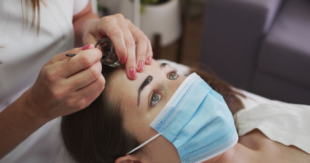 Beautician Performing Microblading Eyebrow Procedure on Woman - Free Images, Stock Photos and Pictures on Pikwizard.com