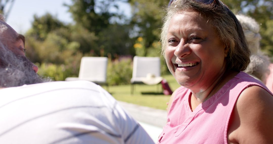 Senior Woman Enjoying Outdoor Friendship on Sunny Day