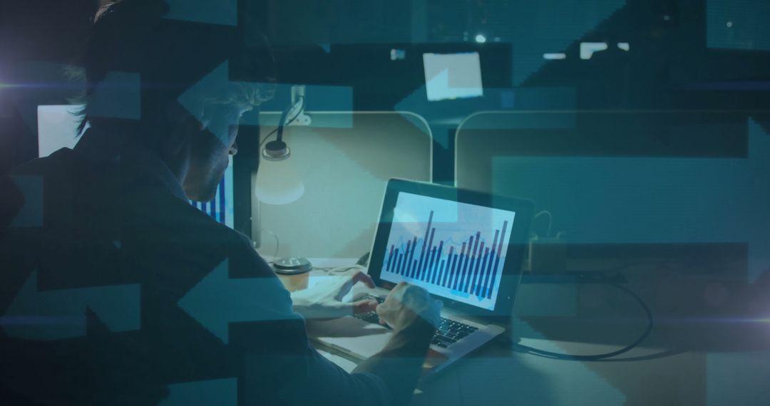 Business Professional Analyzing Data on Laptop Late at Night