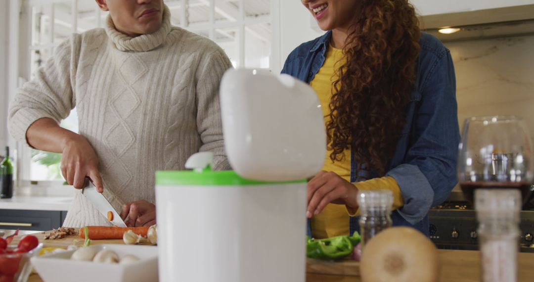 Image of happy biracial couple preparing meal together - Free Images, Stock Photos and Pictures on Pikwizard.com