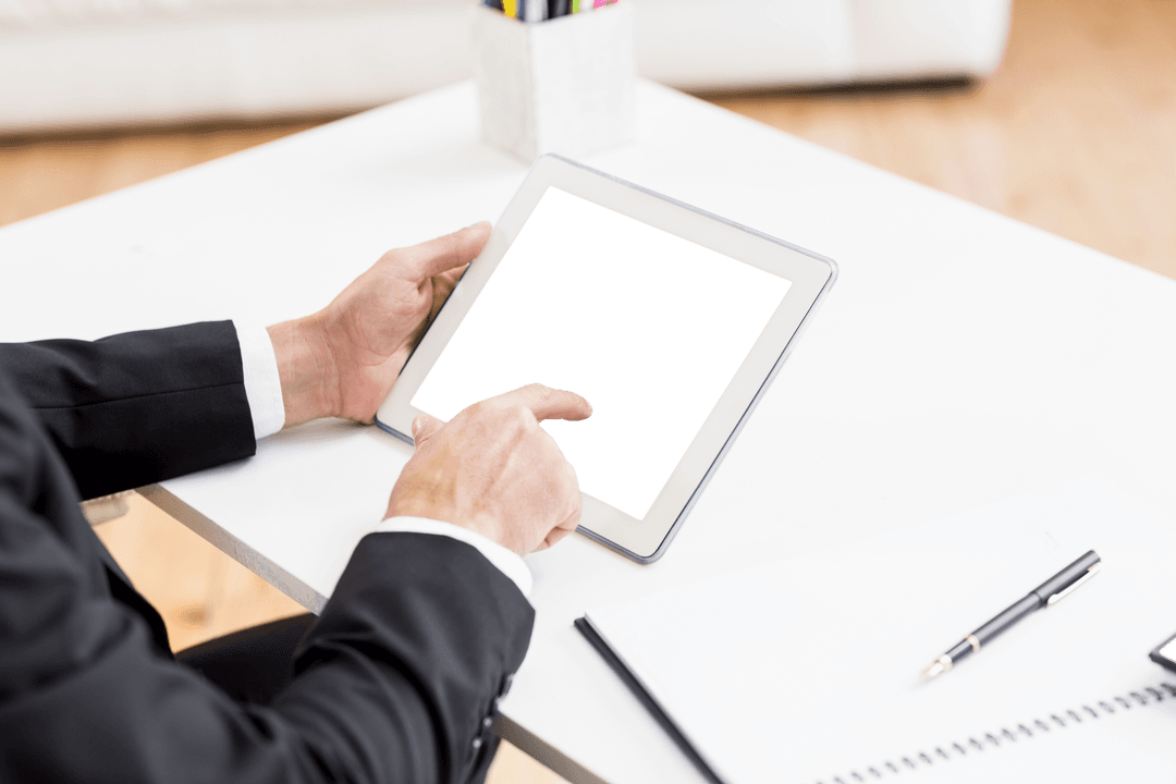 Transparent Screen Tablet Held by Businessman at Desk