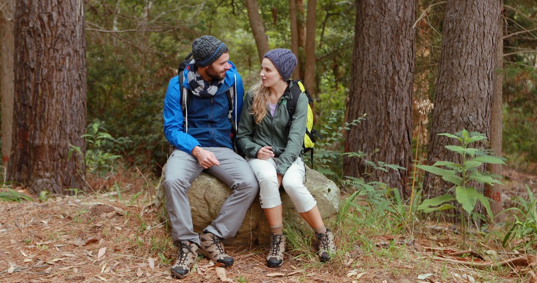 Couple Enjoying a Hiking Break in Forest - Free Images, Stock Photos and Pictures on Pikwizard.com