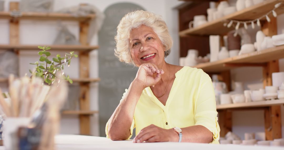 Senior Woman in Pottery Studio Smiling - Free Images, Stock Photos and Pictures on Pikwizard.com