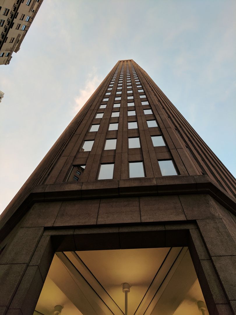 Upward View of Tall Modern Office Building at Sunset - Free Images, Stock Photos and Pictures on Pikwizard.com
