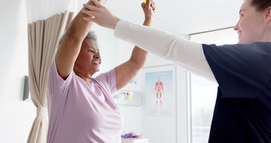 Senior Woman Participating in Physical Rehabilitation with Therapist Assistance - Free Images, Stock Photos and Pictures on Pikwizard.com