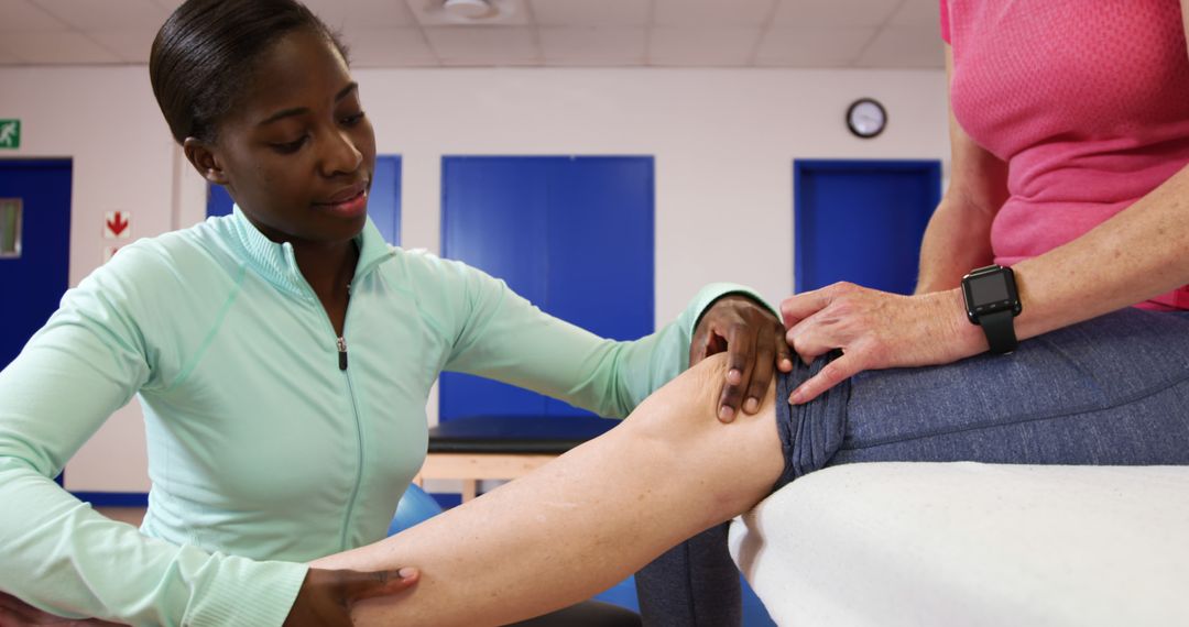 Physical Therapist Examining Knee of a Patient in Clinic - Free Images, Stock Photos and Pictures on Pikwizard.com