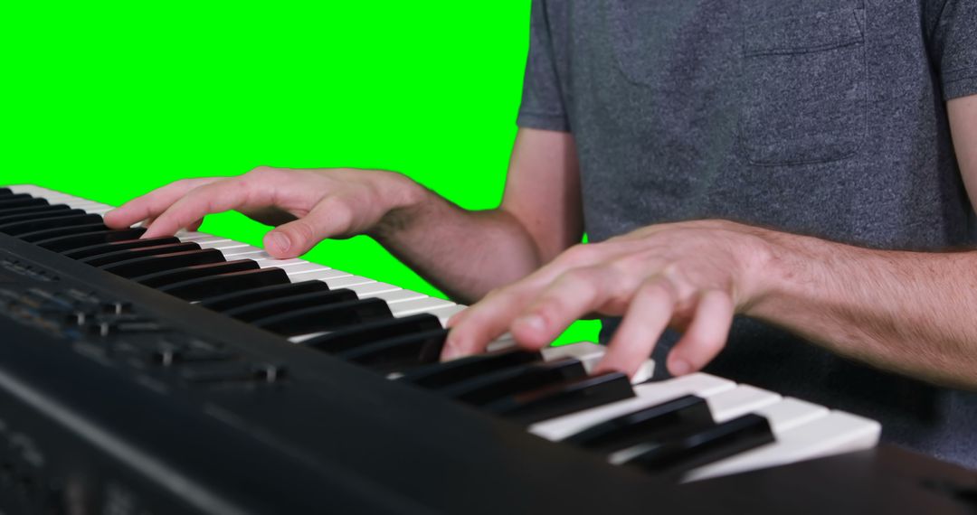 Musician Playing Electronic Keyboard on Green Screen