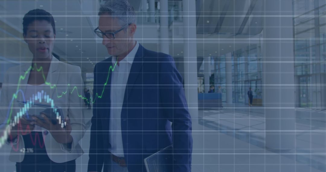 Diverse Business Professionals Analyzing Financial Graphs