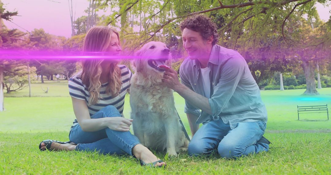Joyful Couple Enjoys Day in Park with Golden Retriever