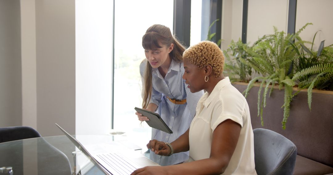 Diverse Women Collaborating in Modern Office