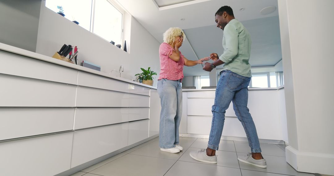 Surprise Kitchen Proposal with Romantic Gesture and Joyful Embrace