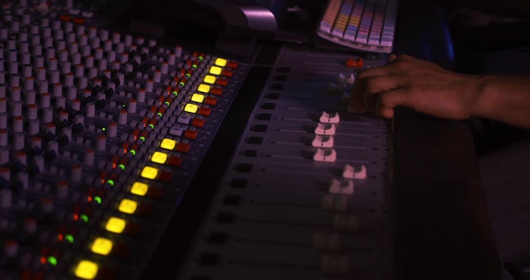 Hands at Work in Recording Studio Adjusting Audio Mixing Console - Free Images, Stock Photos and Pictures on Pikwizard.com