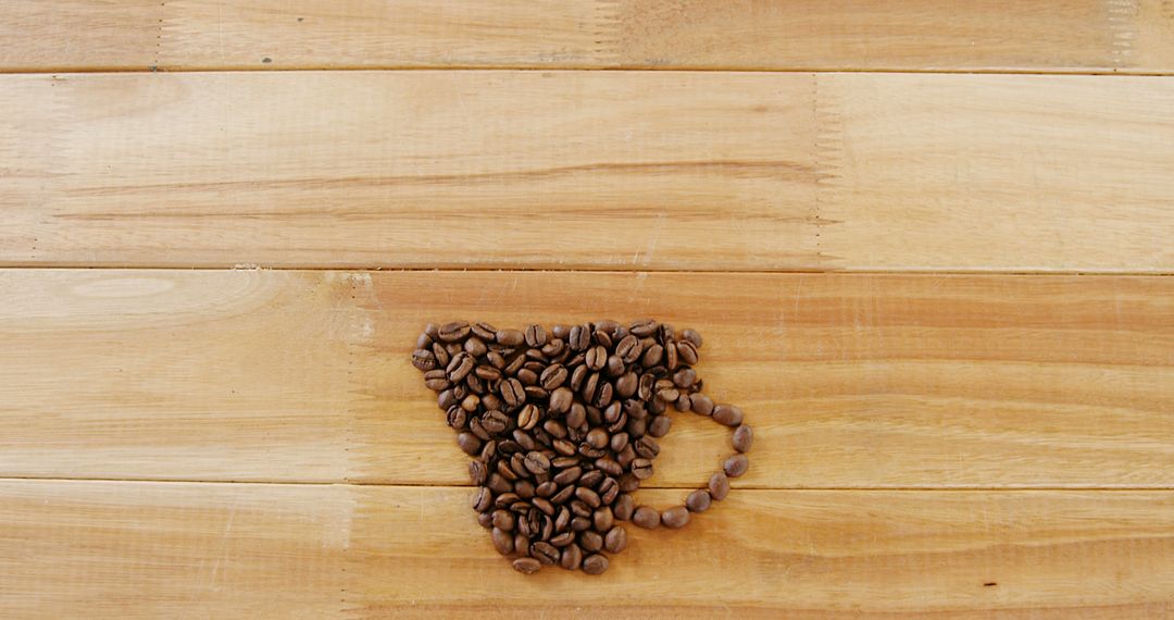 Coffee Cup Made from Coffee Beans on Wooden Table - Free Images, Stock Photos and Pictures on Pikwizard.com