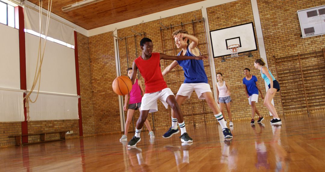 Teenagers Playing Competitive Basketball in School Gym - Free Images, Stock Photos and Pictures on Pikwizard.com