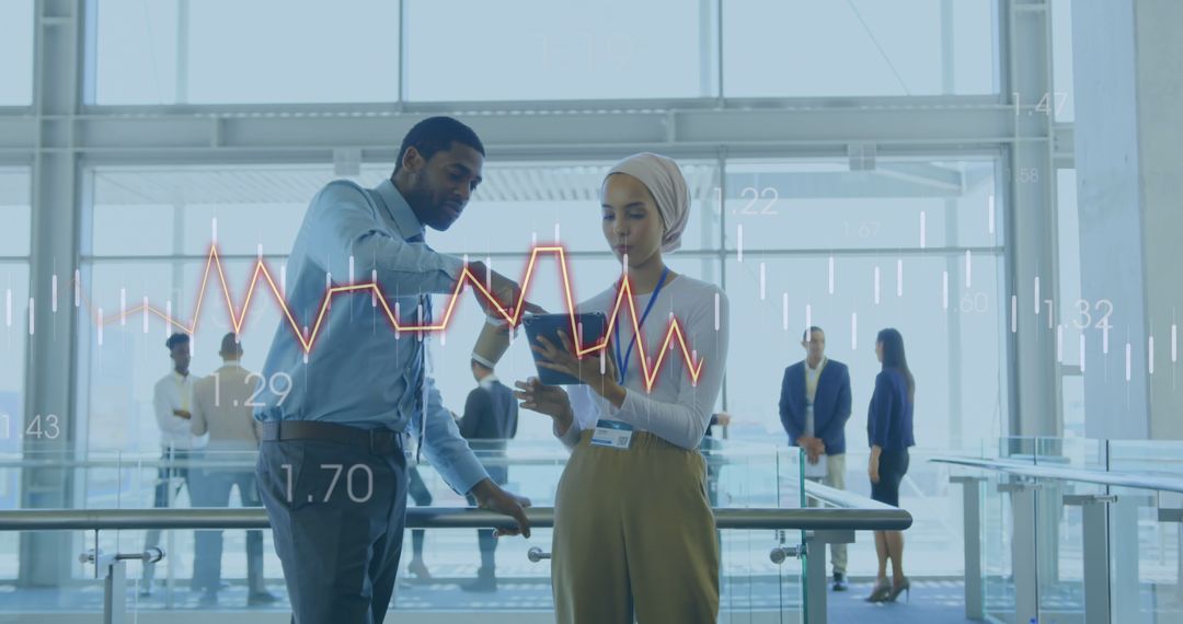 Diverse Business Professionals Analyzing Financial Data on Digital Interface