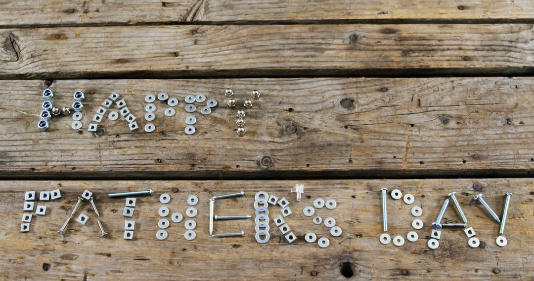 Happy Father's Day Greeting from Nuts and Bolts on Wooden Background - Free Images, Stock Photos and Pictures on Pikwizard.com