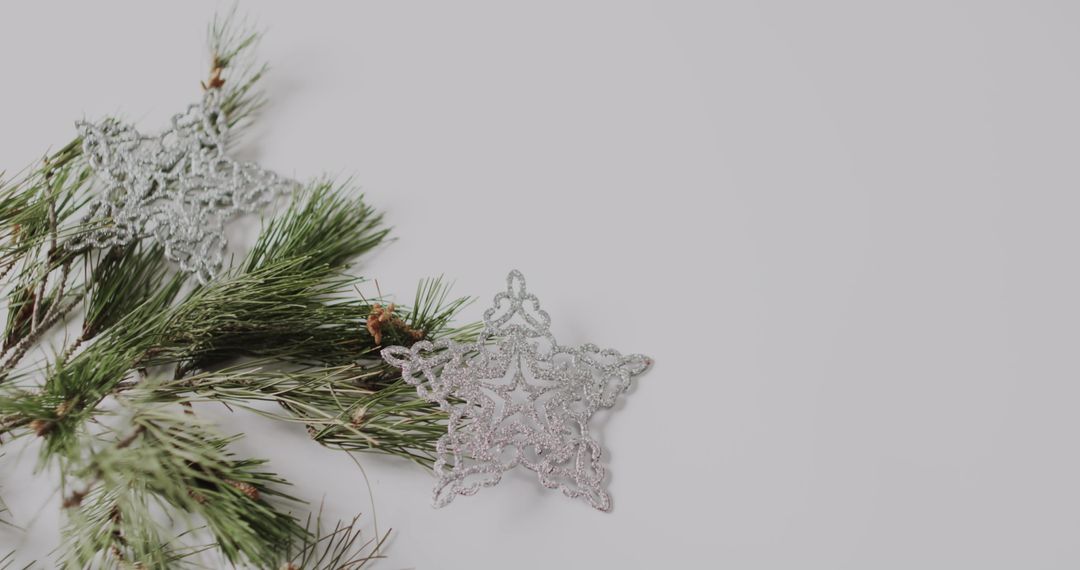 Silver Snowflake Ornament with Green Pine Branches