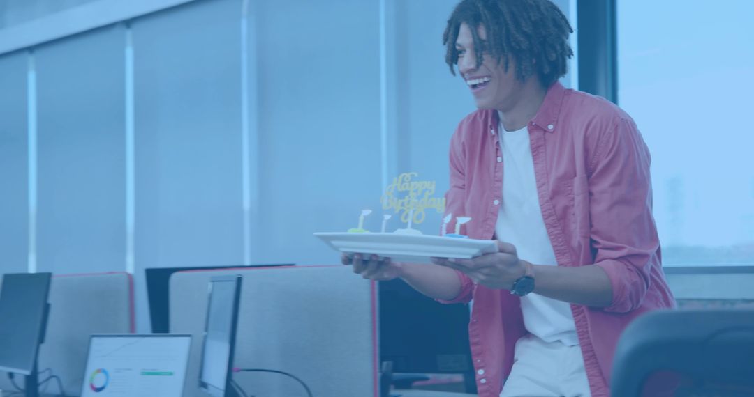 Office Worker Offering Birthday Cake in Open-Plan Workspace Celebrating Coworker