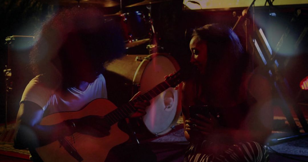 Intimate Acoustic Performance on Dimly Lit Stage