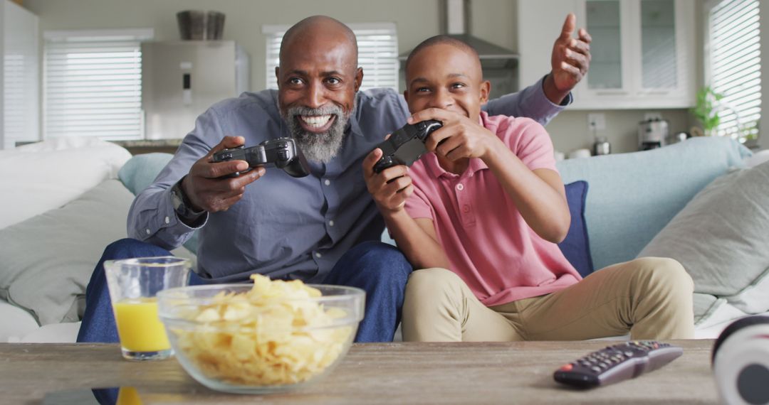 Father and Son Having Fun Playing Video Games - Free Images, Stock Photos and Pictures on Pikwizard.com