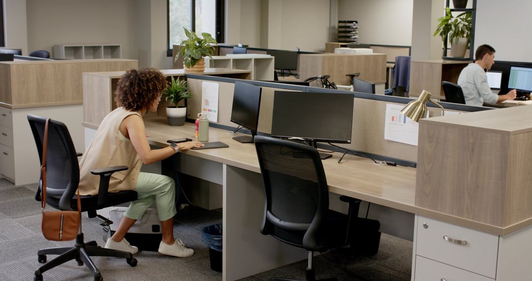 Modern Open-Plan Office with Focused Coworkers and Ample Workspace