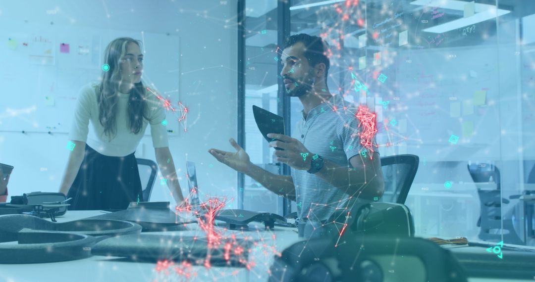 Creative Team Discussing Futuristic Technology in Office Environment