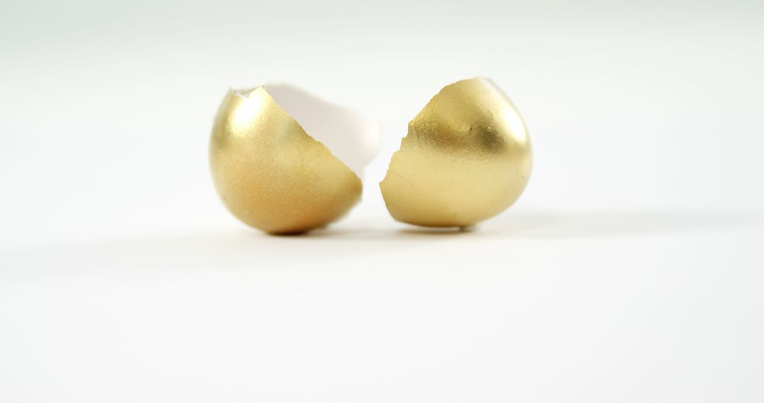 Golden Egg Shells Cracked on White Symbolizing Opportunity - Free Images, Stock Photos and Pictures on Pikwizard.com