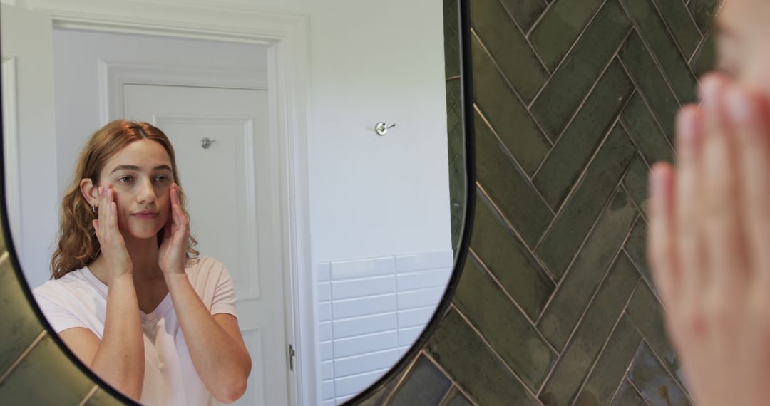 Woman Applying Skincare in Bathroom - Free Images, Stock Photos and Pictures on Pikwizard.com