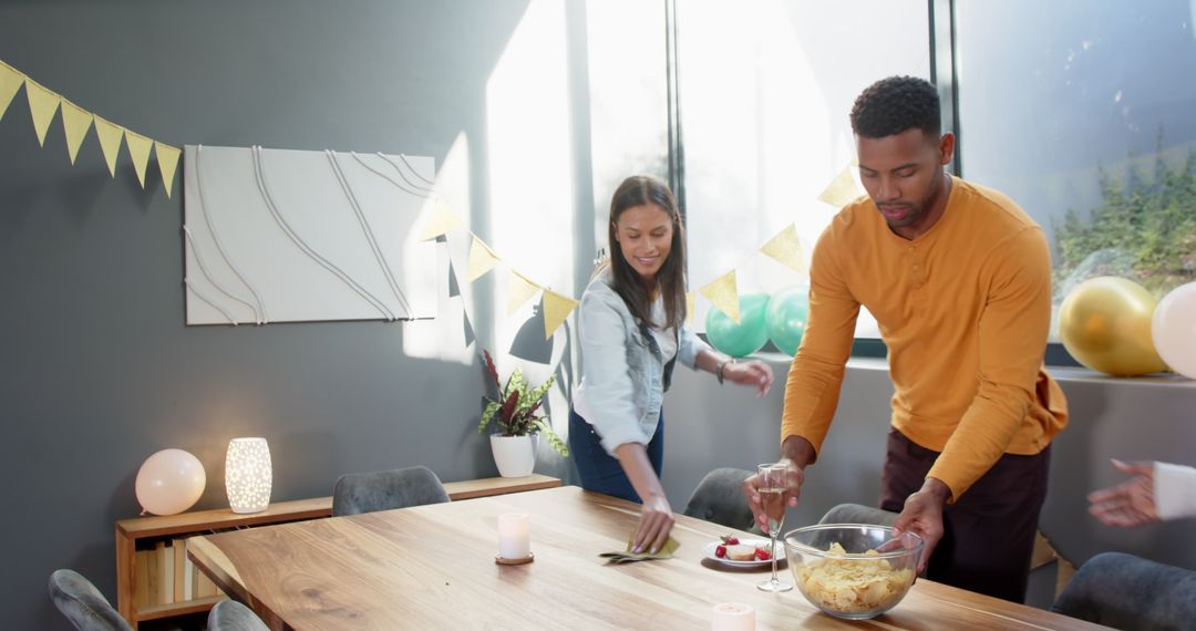 Friends Tidying Up After Happy Birthday Party