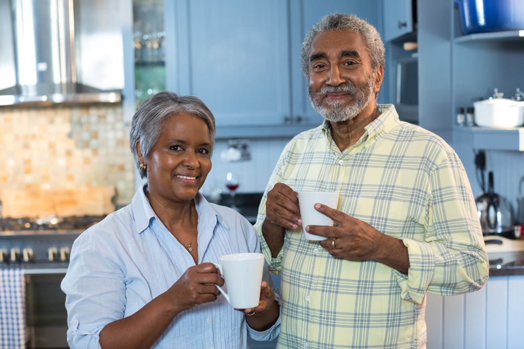 Portrait of smiling senior couple with coffee cups - Free Images, Stock Photos and Pictures on Pikwizard.com