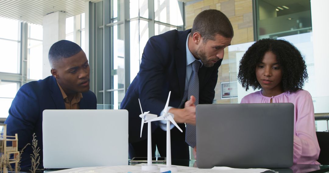 Business Team Discussing Renewable Energy Project - Free Images, Stock Photos and Pictures on Pikwizard.com