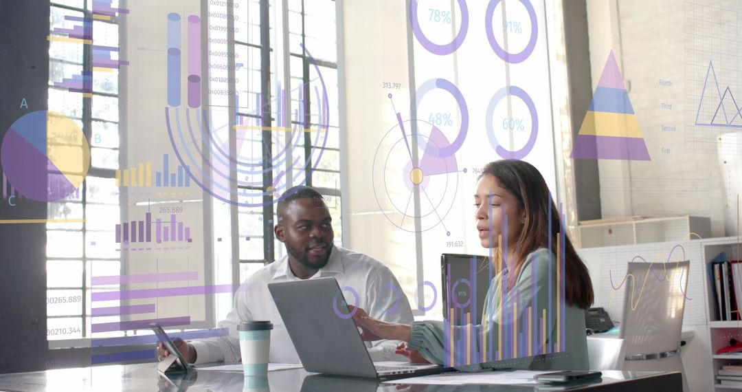 Diverse Colleagues Analyzing Data with Digital Graphs in Modern Office