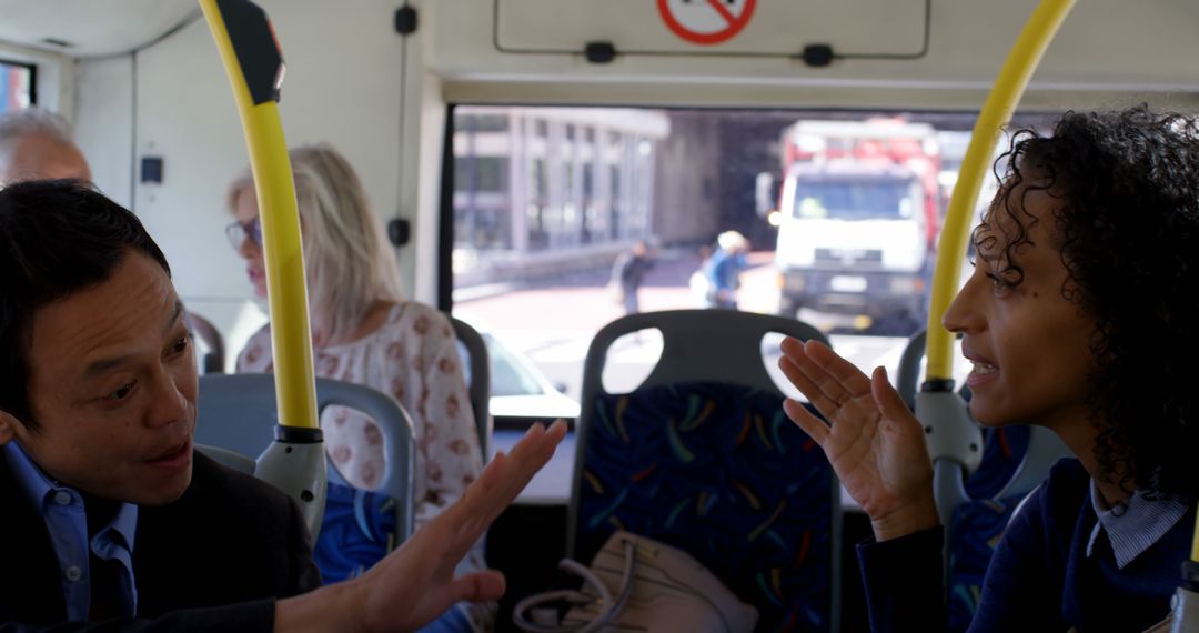 Two Business People Discussing on Public Bus - Free Images, Stock Photos and Pictures on Pikwizard.com